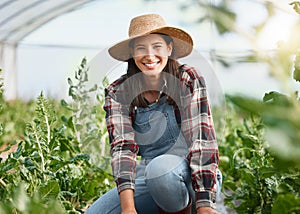 I love putting all the care into my thriving garden. Portrait of a young woman working on a farm.