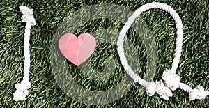 I Love Q rope text layed on green grass surface.