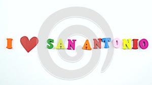 I love San Antonio. Text from colorful wooden letters and a beating paper red heart.