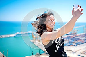 I love selfie! portrait of beautiful brunette girl taking photographs of herself