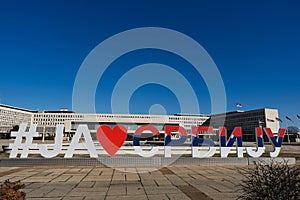 I LOVE SERBIA hashtags tricolor text sculpture in front of the government building of Palace of Serbia in Belgrade. Many