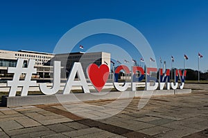 I LOVE SERBIA hashtags tricolor text sculpture in front of the government building of Palace of Serbia in Belgrade. Many