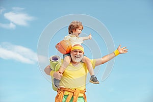 I love sport. Healthy family lifestyle. Elderly sporty man and young boy sporting morning workout - copy space