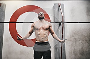 I love starting with this workout. a young man skipping rope in a gym.