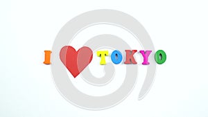 I love Tokyo. Text from colorful wooden letters and a beating paper red heart.