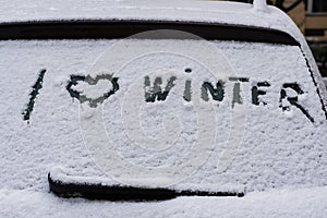 I love winter phrase on the car window. Winter concept.