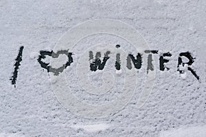 I love winter phrase on the car window. Winter concept.