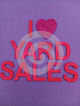 I love yard sales with a heart shape instead of the word love on a purple background