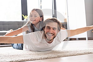 I love you, dad! Handsome young man at home with his little cute girl are having fun together