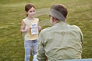 I love you daddy. Father and his cute little daughter celebrating Happy Fathers Day in park on a warm day, small girl