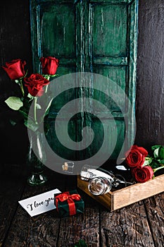 i love you greeting card, gift, red roses and champagne bottle with glasses