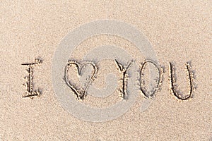 I love you handwritten in sand for natural