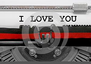 I LOVE YOU text by the old typewriter on white paper