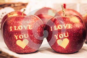 I love you writen on red apples photo