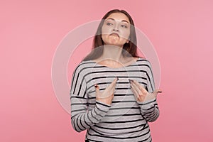 I`m the best! Portrait of arrogant egoistic woman in striped sweatshirt pointing herself and looking supercilious selfish photo