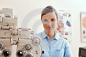 I'm keeping my eyes on yours. Portrait of a confident woman using an optical refractor in an optometrists office.