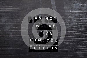 I`m not weird, I am limited edition on wooden blocks. Education, Motivation and inspiration concept