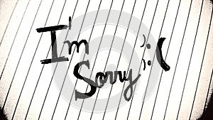 `I`m sorry` manuscript on a piece of paper