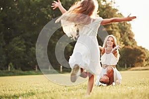 I missed you so much. Mother and daughter enjoying weekend together by walking outdoors in the field. Beautiful nature