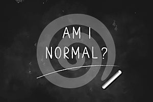 Am I Normal ? written with chalk on blackboard icon logo design vector illustration