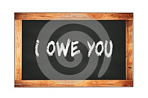 I  OWE  YOU text written on wooden frame school blackboard