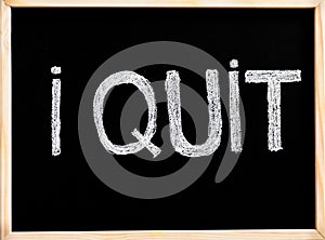 I quit message, handwriting with chalk on blackboard