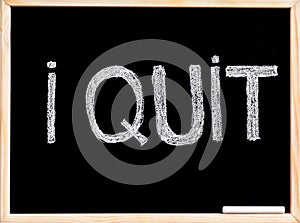 I quit message, handwriting with chalk on blackboard