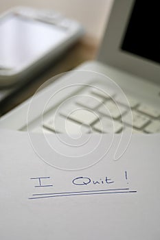 I quit, resignation on desk in an office