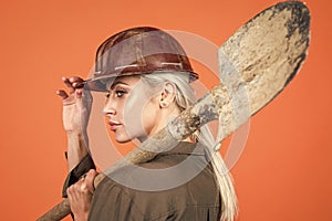 i am ready. foreman girl wear safety hardhat. labor day. woman in boilersuit and helmet