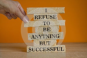 I refuse to be anything but successful. Motivational quote to create future. Words on the brick blocks on beautiful orange