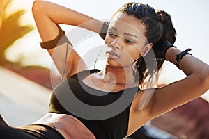 I refuse to give up on myself. a young woman doing sit ups.