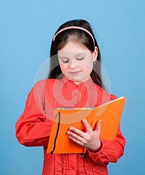 I am a reporter. Adorable school reporter. Small girl writing journalistic story down in note book. Being a reporter she