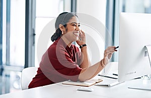 I resolved the issue for you on my side. a young businesswoman wearing a headset while working on a computer in an