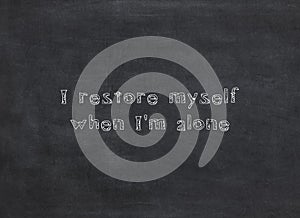 I restore myself when I'm alone written on a blackboard