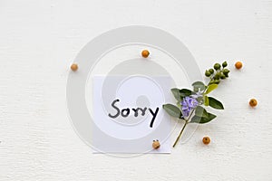 I am sorry message card handwriting with flowers