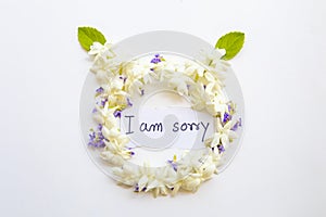 I am sorry message card handwriting with jasmine ,purple flowers