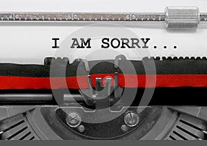 I AM SORRY text by the old typewriter on white paper