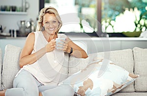 I start everyday with a fresh cup of coffee. Cropped portrait of an attractive mature woman enjoying a warm beverage