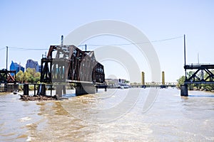 The I Street Bridge is a historic metal truss swing bridge located on I Street in Sacramento; the Tower Bridge and the city's