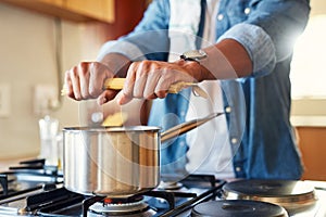 I think I cracked the perfect spaghetti code. a man breaking spaghetti before boiling it.