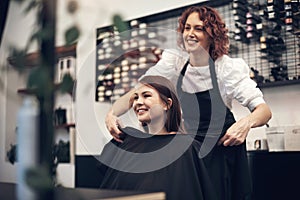 I think I finally found my soulmate, I mean hairmate. a young woman looking happy after getting her hair done at the