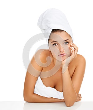 I think I need a new routine. Cropped portrait of a gorgeous young woman looking bored while wrapped in towels against a