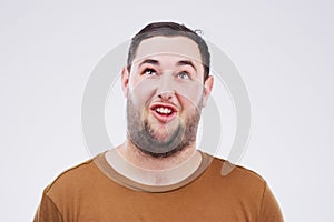 I think its time to find a new normal. Studio shot of a young man making a funny face against a gray background.