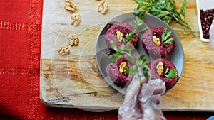 I throw pomegranate seeds. Pkhali traditional Georgian food. Beetroot is used for the purple color. Walnut is used for