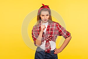 I told you! Portrait of strict pinup girl in checkered shirt and headband teaching with admonishing gesture, warning