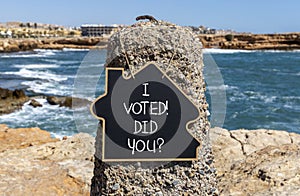 I voted. Did you symbol. Concept words I voted. Did you on beautiful black chalk blackboard. Beautiful stone blue sea sky