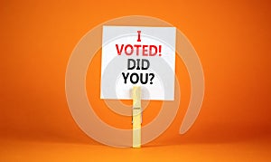 I voted. Did you symbol. Concept words I voted. Did you on beautiful white paper on clothespin. Beautiful orange background.