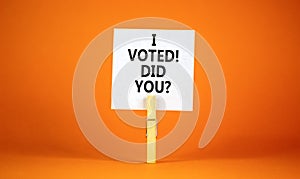 I voted. Did you symbol. Concept words I voted. Did you on beautiful white paper on clothespin. Beautiful orange background.