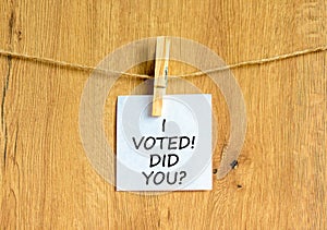 I voted. Did you symbol. Concept words I voted. Did you on beautiful white paper on clothespin. Beautiful wooden background.