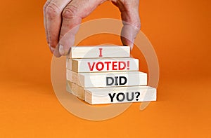 I voted. Did you symbol. Concept words I voted. Did you on beautiful wooden block. Beautiful orange table orange background. Voter